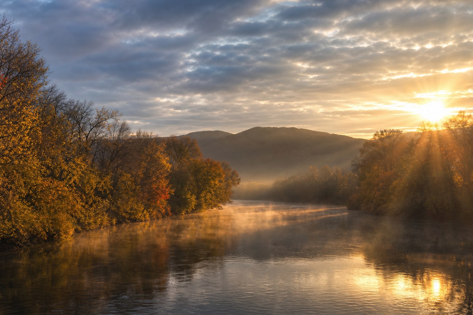 River lined with autumn trees near rolling hills in Middle Tennessee at sunrise, AI-generated representative image